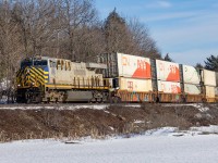 The calm of a sunny winters day is broken by the first of 3 1+1 CN stackers headed west.