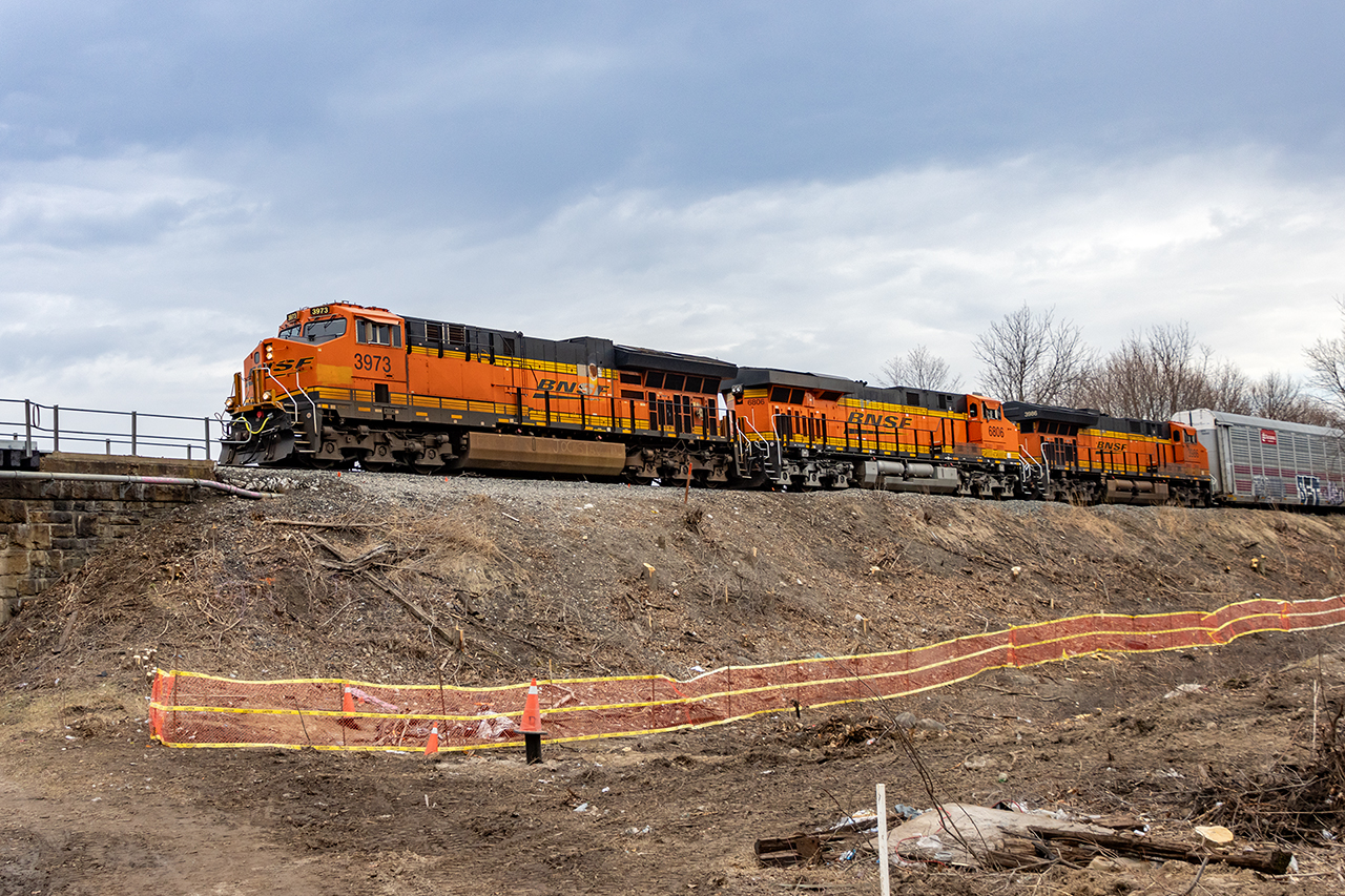 Foamers delight. I suspect that most who participate in this hobby have all had dreams of taking a chainsaw to the edge of the right of way to open up some new angles. The city of Cambridge has acceded in this dream; perhaps to finally enlarge the Beverly St bridge, but who knows. Yes, there's still some tidying to do; maybe a shrubbery or two :) but today,  BNSF's 3973, 6806 and 3986 have CP 137 well in hand heading for Wolverton and eventually Chicago seen from this new angle.
