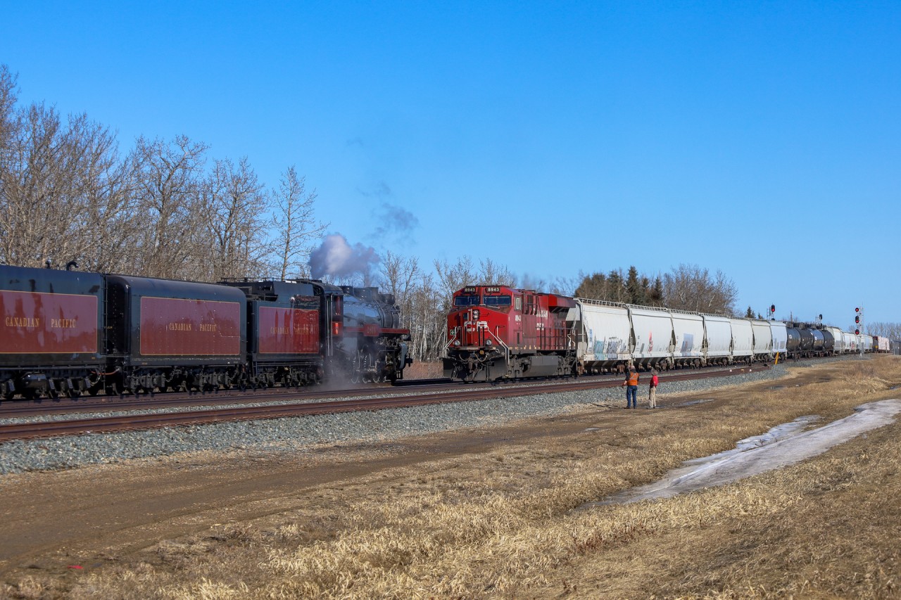 CPKC 242-18 eases into the siding at Netook for a meet with the 2816 which was making another break in run up to Edmonton.