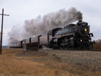 In some places, The Leduc Sub feels like you’re stepping back in time.  ABS territory with aearch light signals, that are connected to the intact and in service pole line; along with relay boxes are regular intervals.  It makes for a great place to shoot a relic from the past like the CP 2816.   Seen here blasting through Menaik, Alberta and by what could be an old CP structure, no doubt dating back to a time when steam was king on the northern Prairies.  