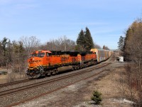 CPKC has sent us a number of interesting lash ups over the past month or so with a BNSF leading a great number of trains both east and westbound. Here, BNSF 7859 with BNSF 5470 pull their way across Appleby Line with forty nine auto racks in tow as they work their way up the grade on the approach to Guelph Junction cleared to Ayr.