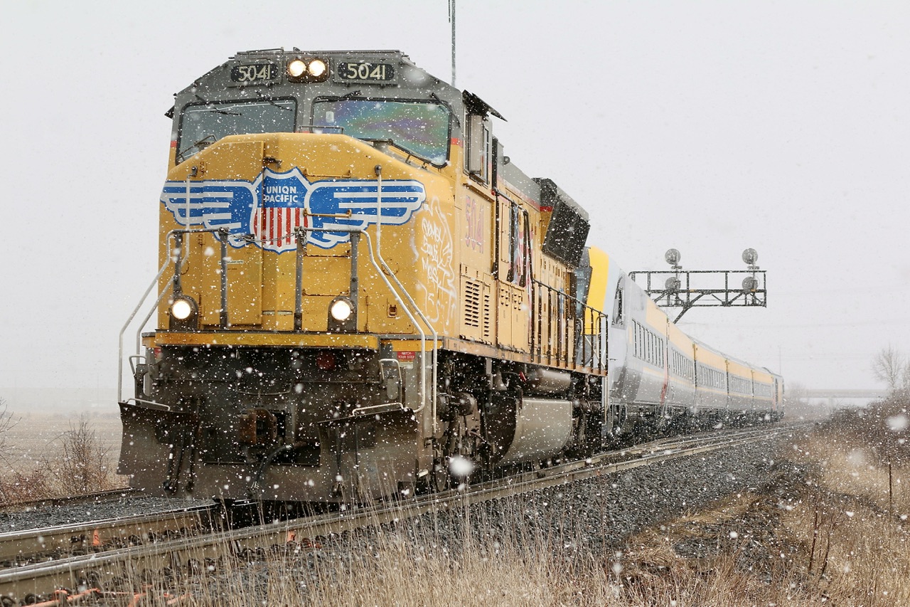 I finally managed to catch one of the new VIA Seimens set on delivery and honestly I was more excited about the UP SD70M leader, LOL! Nevertheless it was neat seeing one fresh off the assembly floor. I know in service these will get boring fast. Unfortunately the skies decided to open up with a blizzard just before the train arrived.