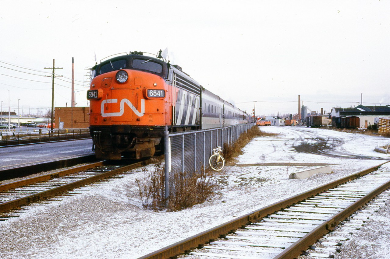 Here's a neat photo I came across from my dads collection- A CNR Windsor bound passenger train in a 1X1 configuration and with the old Oakville basket factory siding in the background. Check out the old rail cars to the far right in the photo, one would wonder if they were left behind for storage etc. The passenger train is heading westward when track 3 at Oakville was connected to the main at the west end before Kerr street.