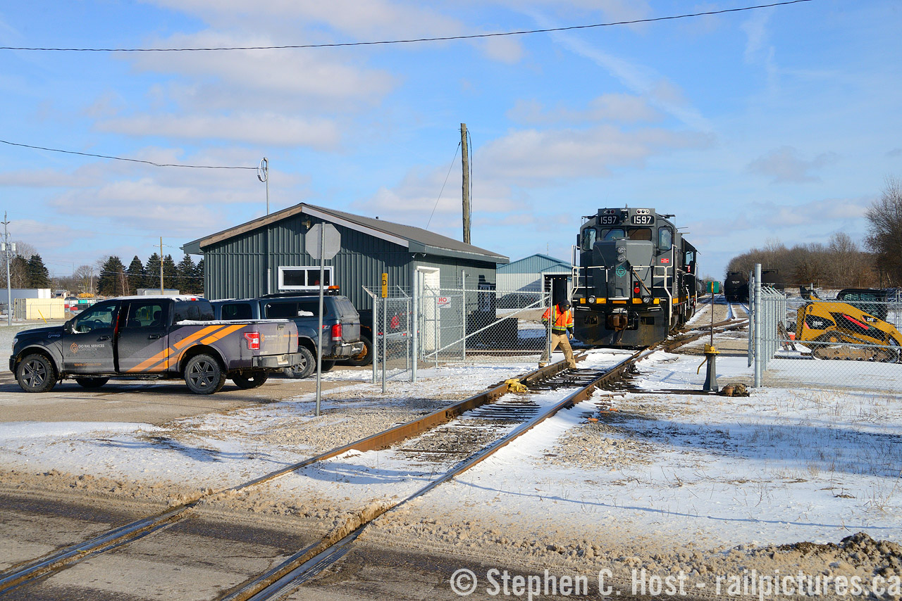 A little method to my madness as I posted This image of the St. Thomas and Eastern Railway in Tillsonburg, then owned by the Trillium Railway. The Trillium was bought in full by GIO in 2018 (long after Trillium closed this line) and GIO has re-opened it as the St. Thomas and Tillsonburg Railway. GIO does things differently, they've fenced off most of their yards (in part) and all the added stuff in the way means I can't do what I had done in 2013, photographically speaking. Pictured above is the train arriving light power after having set off their cars in the Tillsonburg siding just west of the bridge, they would pull to the building, toss on the derail and mmediately close the gates ending another day of service. The yard in the background is quite full as they have been collecting storage cars and stuffing most sidings along the route with 'em. Brad K asked, and while the main building still stands as you can see, with GIO improvements, the secondary building just behind it was torn down a couple years ago. I'm not exactly sure but the station had to be close to here? Anyone know?