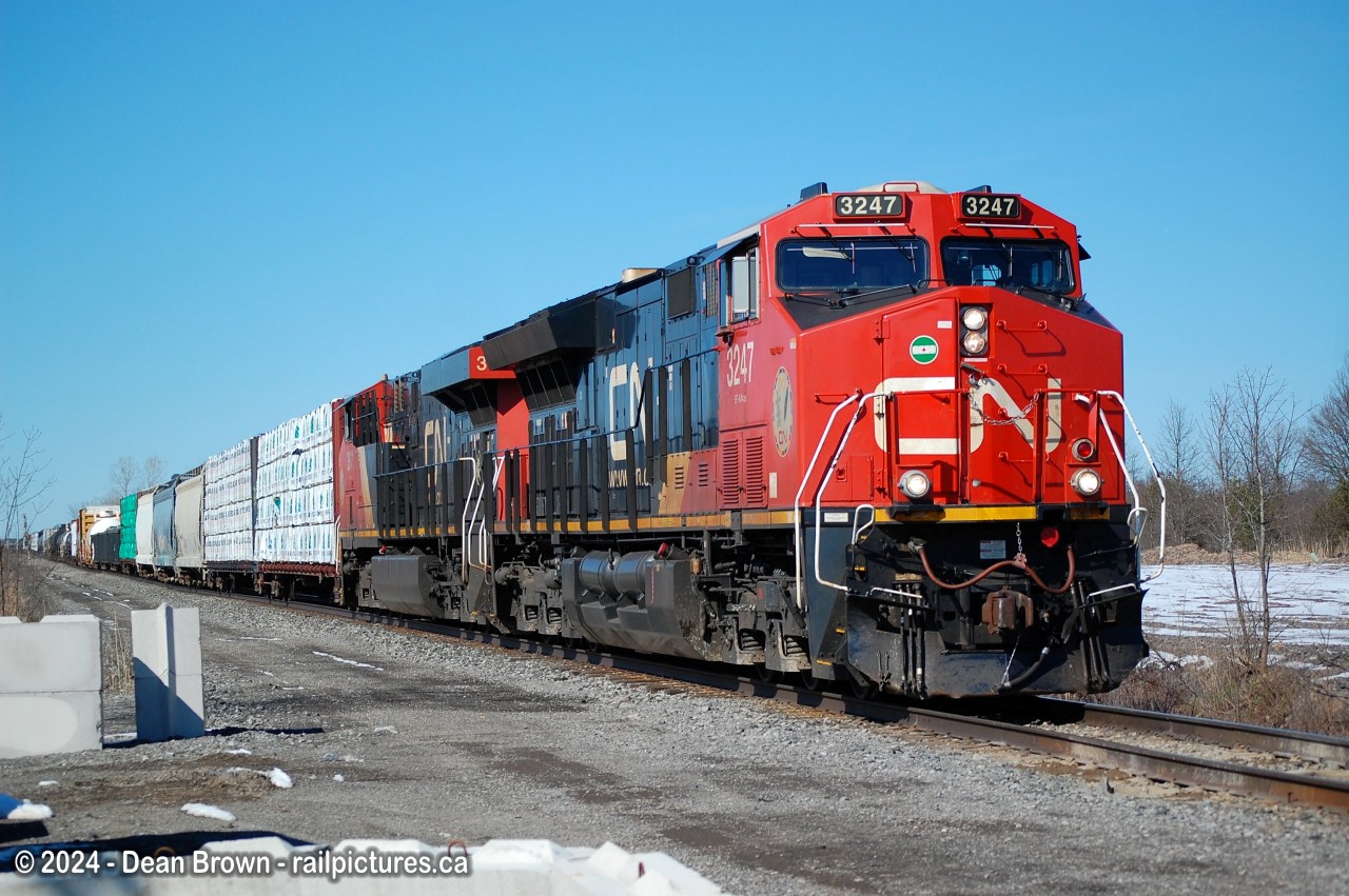 I caught CN 531 with CN ET44AC 3247 and CN ES44AC 3811 at Netherby Rd. on the CN Stamford Sub on a sunny afternoon as the snow melted away from our last Snow.