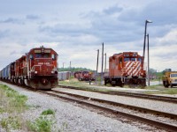 The former CASO Welland yard was a much more exciting place back then. There was a decent mix of power this day with SD60, SD40’s and GP9’s. Here a road train waits on a fresh crew while the yard job awaits the same. If you look closely behind the GP9 you can see the start of a long line of non dash2 SD40’s awaiting disposition. There are also another pair of SD40’s idling away awaiting their run back to Hamilton. 
