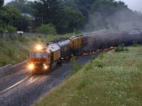 An early morning grind in a thunderstorm. Sparks won't be an issue for a while. 