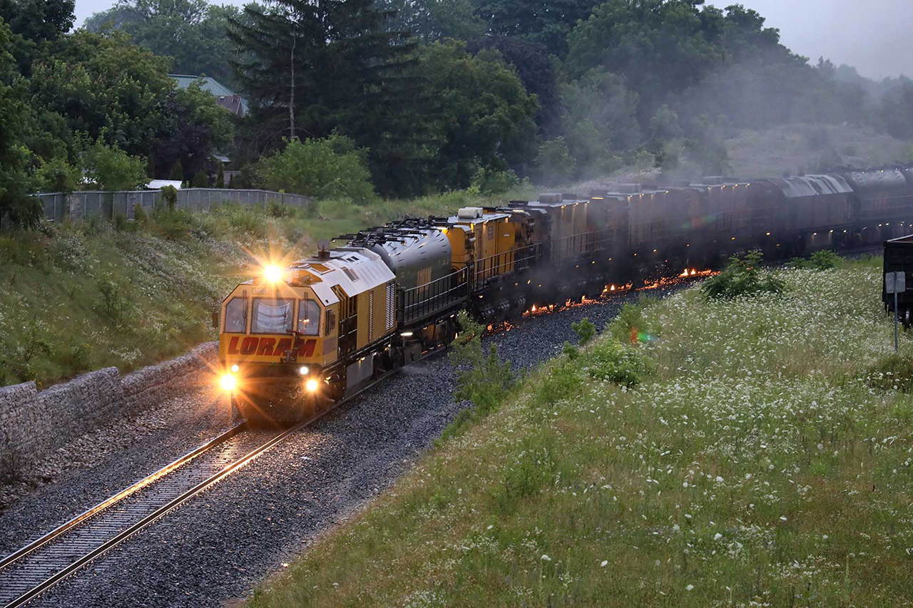 An early morning grind in a thunderstorm. Sparks won't be an issue for a while.