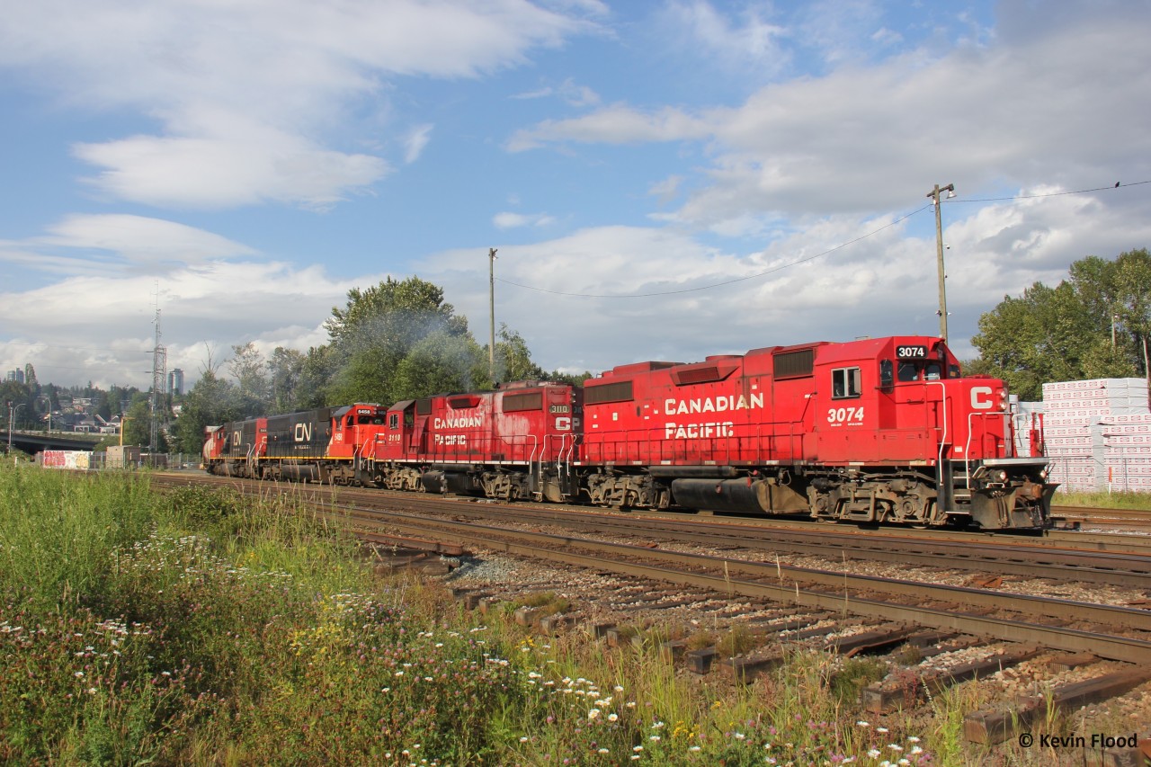 A CPKC transfer train came out of nowhere at Braid just as the sun appeared on a nice late spring evening. It had CP 3074, CP 3110, CN 5458 & CN 5411 for power. In New Westminster, you just never know what could show up.