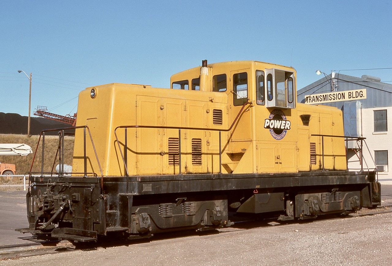 Following up on my post last week of an SPC critter, at the Queen Elizabeth Power Station in Saskatoon, Saskatchewan Power Corporation‘s un-numbered GE 80-tonner s/n 32811 built January 1957 was the primary locomotive for switching hopper cars of coal fuel, seen here on Monday 1976-10-11.  There is no rail access there nowadays, as the power plant now runs on natural gas.