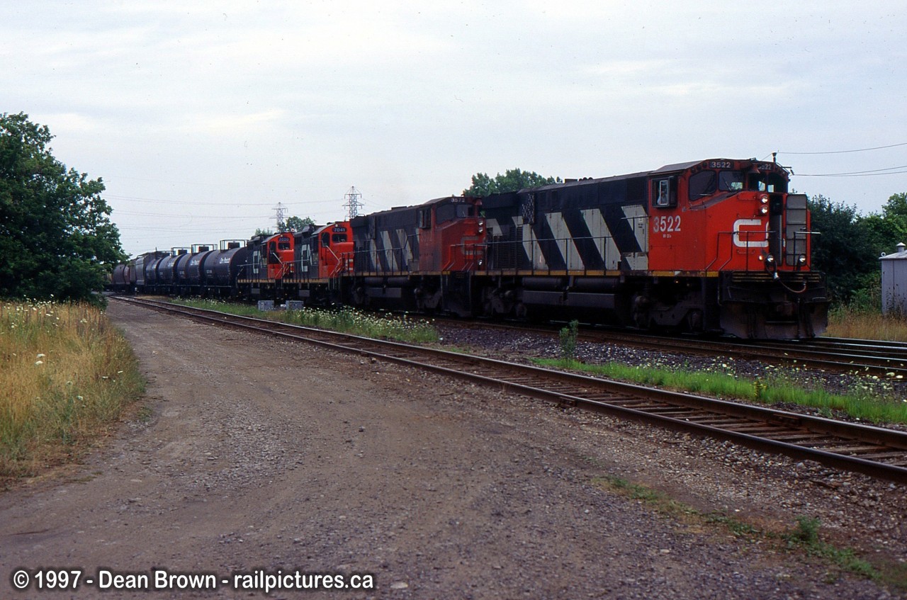 Back in the days when Niagara Falls Yard was still active and locals as 569 headed up Clifton and onto the wye for Port Robinson in July 1997.