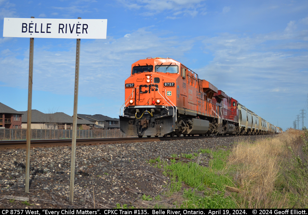 Every Child Matters in Belle River, but then every child matters no matter where they are.  CP 8757 speeds past the 'Belle River' mileboard and into the late afternoon sun as it heads west towards Windsor on the CPKC Windsor Subdivision on April 19, 2024.