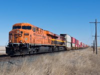 CP 8781 and KCSM 4748 hustle train 101 westward at Grande Coulee SK on a pleasant spring day. 