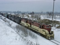 Fortunately TF2 is running late today and we can photograph TH&B 71 and 401 as they assist PC 1752, 1791 and 1773 up the grade into Vinemount in March 1972. The going-away shot can be found here: <a href=https://www.railpictures.ca/upload/a-late-toronto-hamilton-buffalo-run-through-train-tf-2-crests-the-escarpment-at-vinemount-on-a-winters-day-in-march-1972-note-the-thb-puller-engines-a-gp7-and-a-gp9-assisting-the-through><b>https://www.railpictures.ca/upload/a-late-toronto-hamilton-buffalo-run-through-train-tf-2-crests-the-escarpment-at-vinemount-on-a-winters-day-in-march-1972-note-the-thb-puller-engines-a-gp7-and-a-gp9-assisting-the-through</b></a>