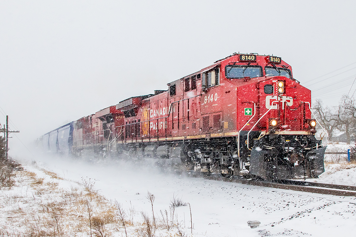 A little snow doesn't slow CP 8140 as it leads an eastbound towards Trenton.