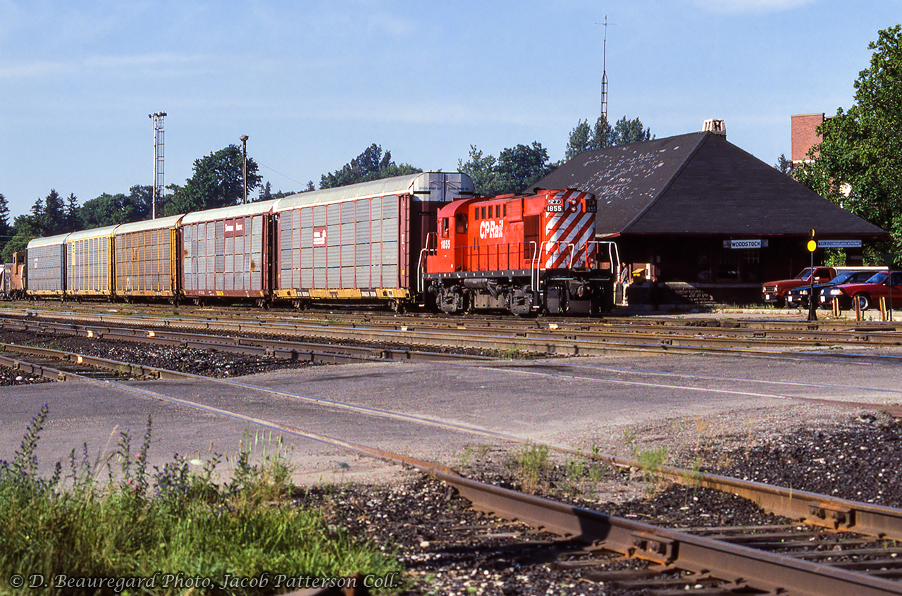 CP RS18u 1855 is stopped at the Woodstock station, preparing to depart with racks for CAMI Automotive at Ingersoll.D. Beauregard Photo, Jacob Patterson Collection Slide.