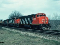 CN 411 is pictured during a sunny break approaching Bayview Jct. on the Oakville Subdivision in Burlington with 9649, 2108 and a 5100-series SD40. 