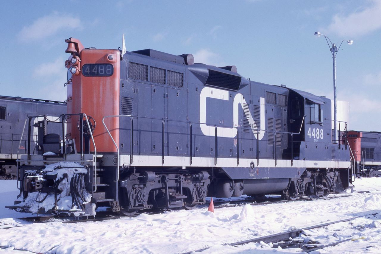 Canadian National GP9 4488 rests on the shop track at the Capreol, Ontario engine facility.  From the mid-1950s to the late 1960s, GP9s were everywhere on CN.  With over 400 GP9s in the family, CN and its subsidiaries had more GP9s than any other railroad.