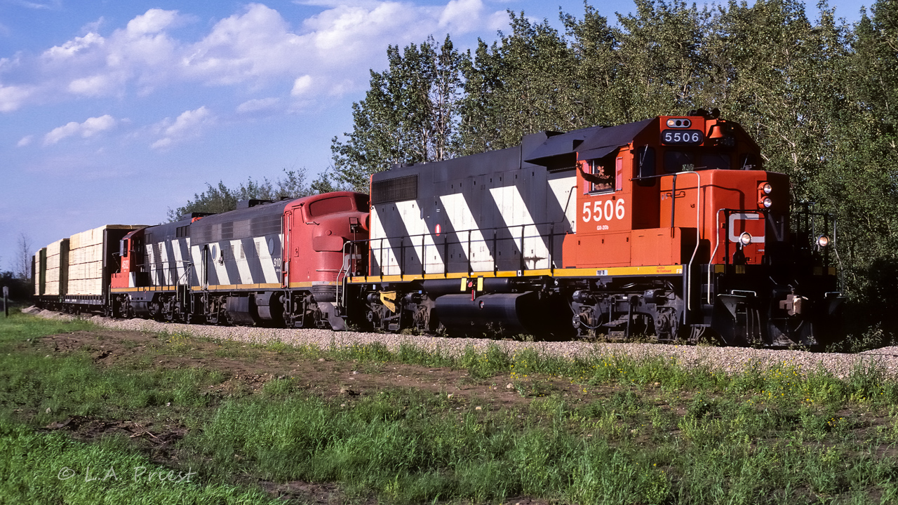 A unit train of sulphur had just come from the Lac La Biche sub with a few loads of lumber on the head end and some loaded grain boxes on the tail end. 30+ hoppers of golden yellow nuggets made up the middle portion of the train. A very typical use of those beetles, with it facing the right direction for a photo. The 4602 is at the rear of this ABA consist. Unusual having a unit train bringing lumber cars home, the Muskeg Mixed generally handled those cars.