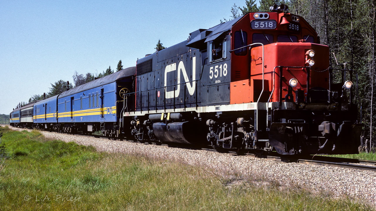 For me at the time, this felt like a great day. A GP38 still in the original noodle scheme and a full sized consist of passenger equipment. With an ex-NAR cab on the tail end. Terrific stuff. For those interested, starting with the lead car, baggage's 7855 and 7856, coaches 4977 and 5099, Cab 79101 at the end. Photo taken at mile 24.4 at lunchtime.