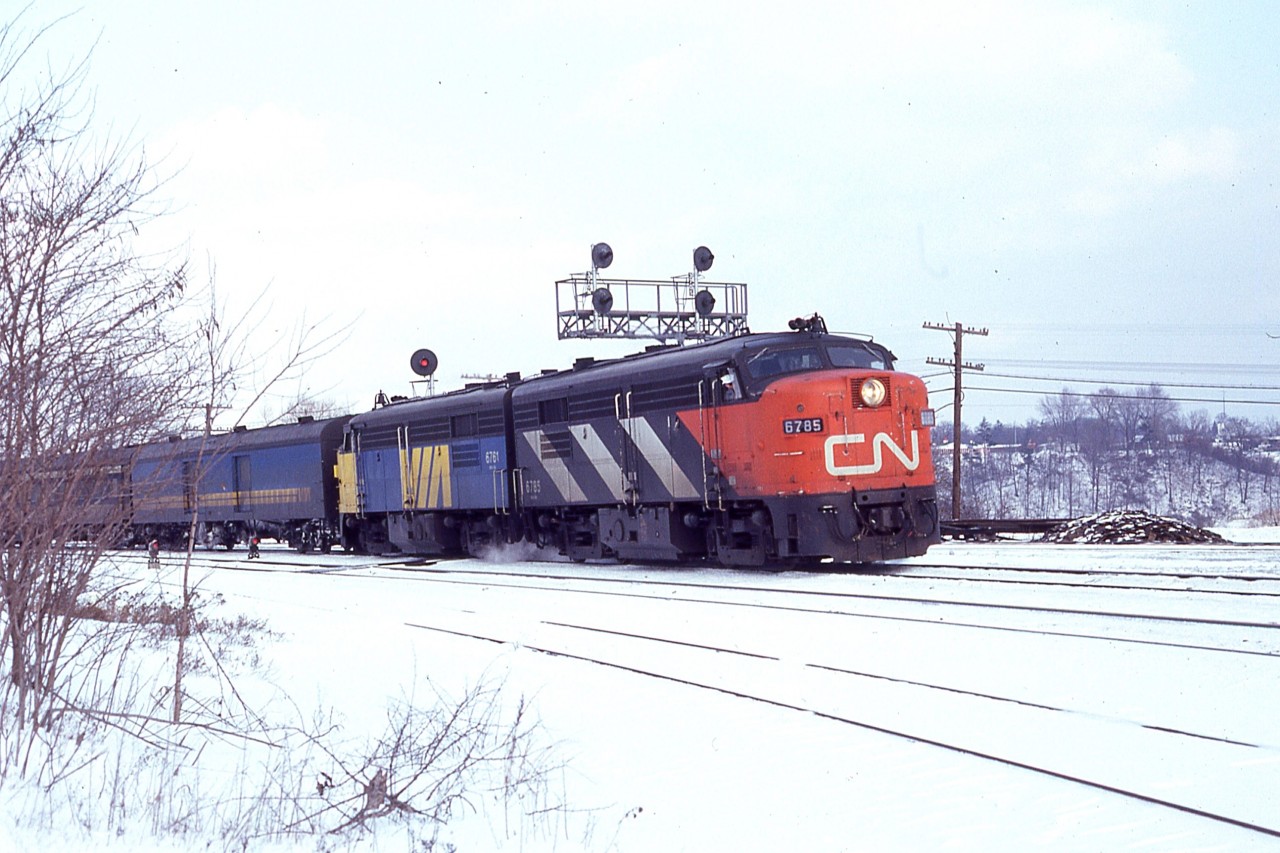 The makeover from CN to VIA on the old cab units was a really interesting time for the fans. The very thought of just what might be seen had me out as often as running away from work would allow. Of course nowhere near as often as I would have liked.
  A nice example of what could be seen is this image taken on a cold day in February 1979. Unfortunately I have misplaced my notes so not sure of the exact date. CN 6785 and VIA 6761 sure looked good as photographed coming off the CN Oakville sub onto the CN Dundas Sub at Bayview Junction, a most popular railfan location between Burlington and Hamilton. I don't believe either of these units have survived over the years.