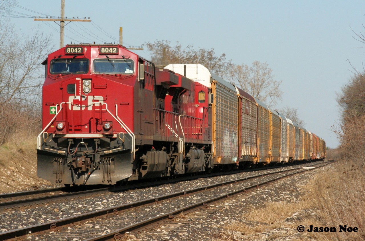 A year ago, on the last day of official Canadian Pacific operations prior to the merger with KCS, CP 137 is viewed waiting patiently at Orrs Lake on the Galt Subdivision for a meet with H88.