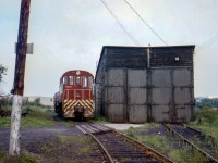 CPR MLW S11 6617 was assigned as the Guelph yard switcher during the summer of 1972, seen here on the Fibreglass Spur, just south of Alice Street alongside the engine house.  Shortly, the crew will be onboard, and headed down to the Fiberglas Canada Inc. facility.  Fibreglas Canada Inc. became Owens Corning Canada Inc. in September, 1989, and the facility is still <a href=http://www.railpictures.ca/?attachment_id=47246>served today by the GEXR.</a>  The engine house was demolished in the late 1970s.<br><br><i>Donald Coulman Photo, Jacob Patterson Collection Slide.</i>