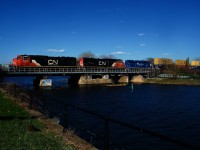 CN 401 has a pair of SD75Is and an ex-GMTX GP38-2 (CN 5780, CN 5726 & CN 4904) as it crosses the Lachine Canal.