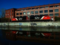 CN 500's power is passing what was once Stelco factory as it heads to Ardent Mills to pick up grain empties.