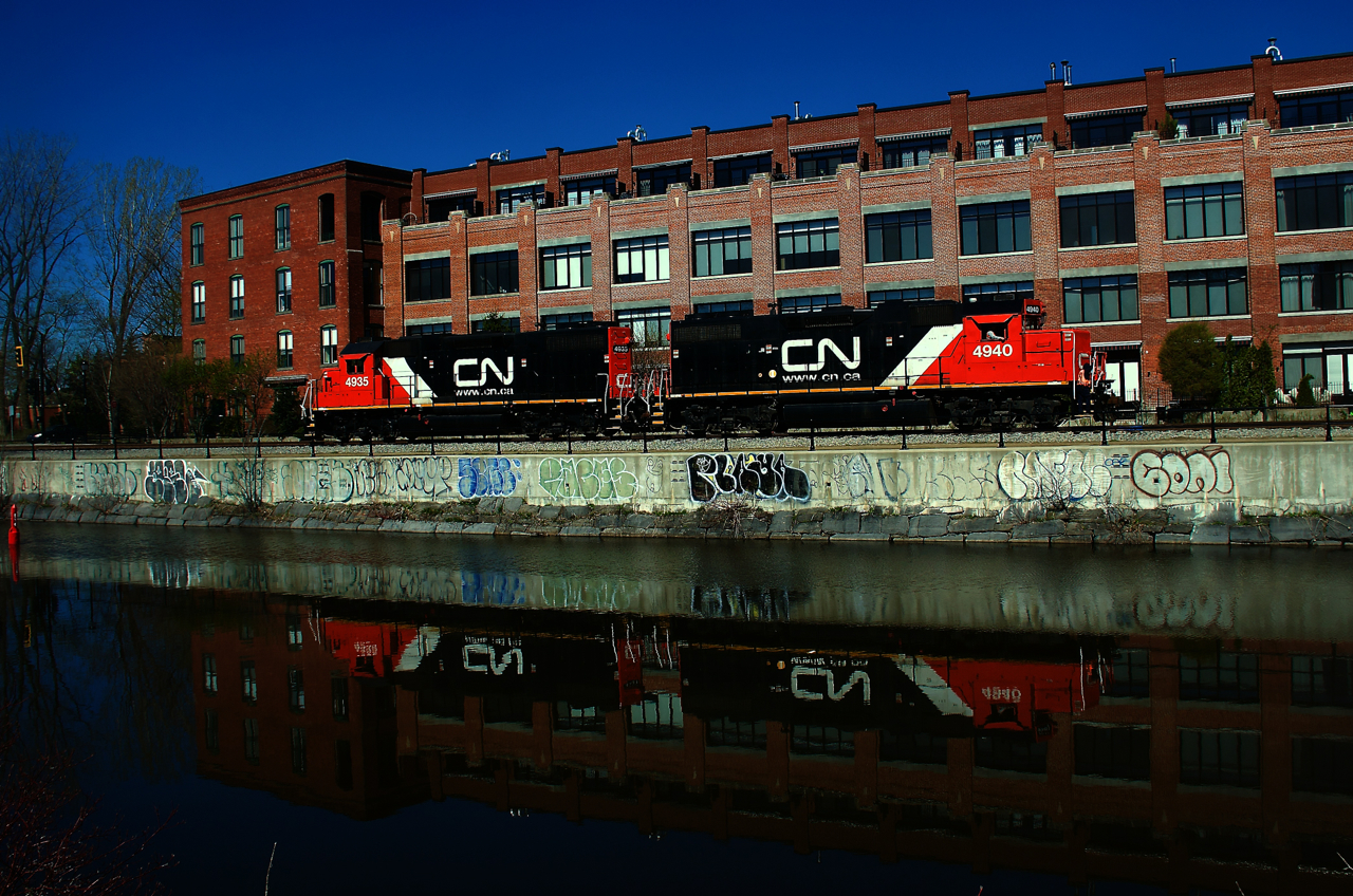 CN 500's power is passing what was once Stelco factory as it heads to Ardent Mills to pick up grain empties.