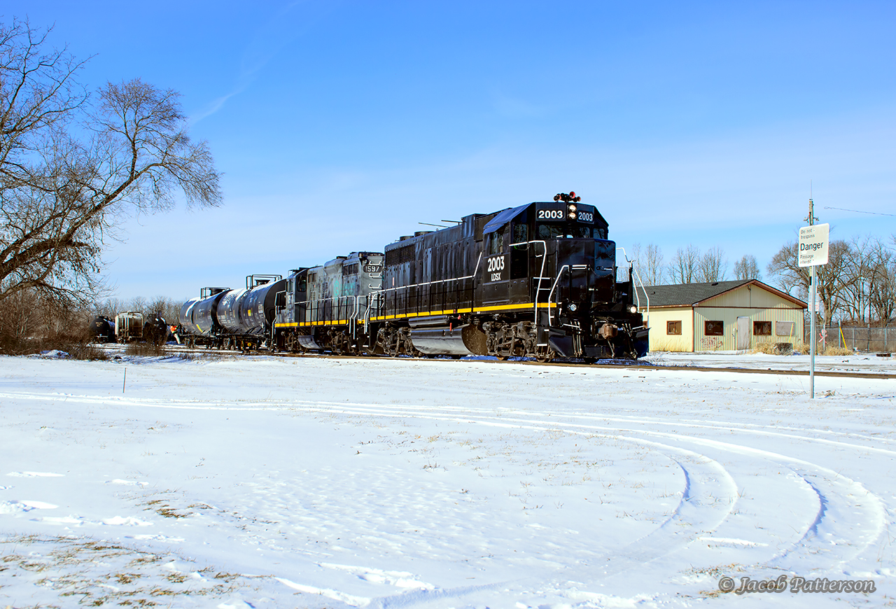Its a busy Monday in St. Thomas where GIO Rail is busy switching out 22 cars in CN's yard, with their traffic today mainly being tanks going into storage at New Sarum and Tilsonburg.

Across town, OSR's St. Thomas Job is finishing up their work at Factor Gas and waiting for GIO to finish their lift before they can gain access to the yard.  They'll meet GIO at the diamond in a few minutes.