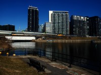 A late VIA 603/601 is backing up towards Central Station as an REM train passes overhead and VIA 63 passes it on the South Track.