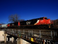 CN 324 crossing over Wellington Street with CN 2333, CN 8001 & 76 cars.