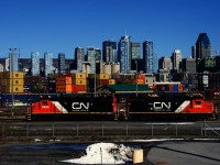 Ex-UP units CN 4935 & CN 4940 are heading west towards Track 29 to pick up loaded grain cars after dropping empty grain cars in the yard.