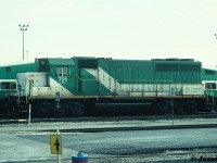 During an April afternoon, stored GO Transit GP40-M-2 721 is viewed at the Mimico, Ontario maintenance facility.  The unit began life as Chicago Rock Island & Pacific after being built by EMDD in January 1967. It was sold to GO in 1982 along with a group of other ex-CRI&P units. The GP40-M-2’s worked on the commuter agency for over the next decade until new GO F59PH’s eventually put them into storage and they were retired. On May 22, 1994, GO Transit 720-724 departed Toronto via CN for the VMV facility in Paducah, Kentucky where they would be rebuilt to EMD Leasing units. Sister GO units 725 and 726 were previously shipped to VMV in 1993 and had become EMD 200 and 201.
