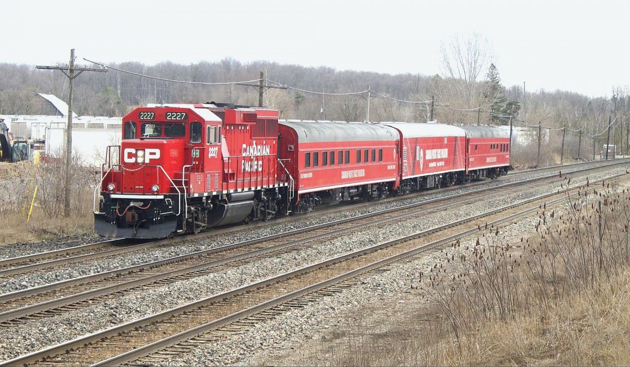 Cp Tec train comes flying by Guelph Junction with cp 2227 in the lead on a cloudy afternoon.