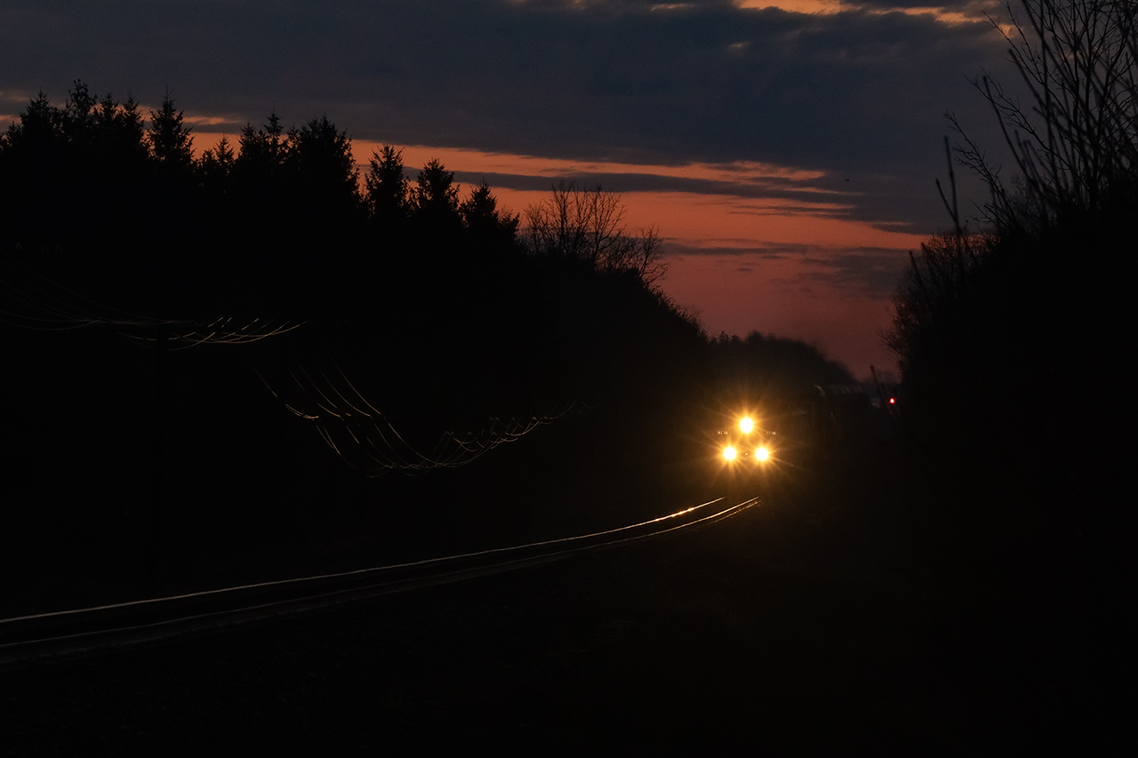 Tis the season of the "sunrise sessions". I'm guessing at least 9000 feet of empty racks and a couple of cars of mixed freight hang on the drawbar as 9718 and 8521 head west half an hour before sunrise.