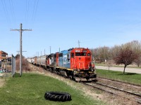 One of the few remaining EMD GP40-2 Grand Trunk Western locomotives in GTW 6420 still in its original Blue and Red paint scheme proved to be a nice surprise today. I had time to kill and figured I'd head off to the industrial basin and see if the GEXR crew were working Dawson Road. There was no one there so I turned around to head off and in the rear view mirror this guy crossed the road so off I took to hopefully get a shot in the bright sunshine. The weeds are very tall along Edinburgh Road but luckily a few tires were stacked there so up I went to get over them. They had quite the large train but wasted no time headed through town and off to Kitchener. GP 38-2, CN 4732 provided the extra power.