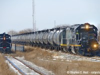 With GIO departing east with 25 cars in tow, they're seen passing the Cando switching operation at Formet Industries, with SW1200 CCGX 1329 (nee CN) working the plant. GIO began humbly, with <a href=http://www.railpictures.ca/?attachment_id=49437 target=_blank> Very short trains in the beginning</a> but they have sure proved everyone they can bring the business. Soon, not far from here, construction will begin on a $20 million rail spur, including two overpasses  for the Volkswagen battery plant. The contract was awarded on Thursday and construction begins THIS month (April 2024). With the spur on the CN side of the Cayuga, it means CN will likely haul all the traffic, but it's not known who will get the switching contract for the plant. Surely there will be a ton of interest from local companies, such as Cando pictured, along with many other local switching contract operators.

