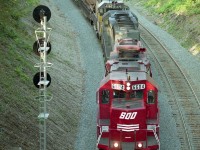 It was getting rather late in the afternoon as CP's #522 rolled into Hamilton.  The image was shot from a little bridge that provides the entrance to Cathedral Basilica Christ the King, that city landmark that can be seen for miles by eastbound drivers on the Hwy 403. No engines on this train carry the CP banner, although SOO was part of the CP family back then. The leader 6604 was painted into CP colours around 2000. Later in 2016 it was absorbed into the company's ECO program. Trailing units, both leased, are PNCX 3012 and HLCX 4062. In 1995 CP was really heavy into leasing, having more than 200 units working system-wide, as new locomotive orders were just beginning to arrive.