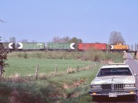 <br>
<br>
 CP Rail 434723, built 1981 by CP Angus, holds the markers,
<br>
<br>
 At the west end Lovekin, mile 155.6 Belleville Subdivision, 
<br>
<br>
 CP Rail Second 927, the view from Concession road #1, May 11, 1985 Kodachrome by S Danko
<br>
<br>
 Head end:
<br>
<br>
     <a href="http://www.railpictures.ca/?attachment_id=  53949 "> CP Rail  second 927   </a>
<br>
<br>
And the 1979 Pontiac Parisienne wagon.
<br>
<br>
sdfourty