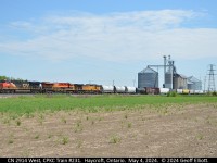 CPKC train #231 rolls through Haycroft, Ontario on May 4th with a mixed batch of power including CN 2914 leading with KCSM 4755 and UP 6249 trailing.