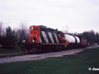 CN GP9RM 4132 leads the 15:30 Kitchener Job through Waterloo Park approaching Seagram Drive in Waterloo, Ontario. The job has one tank car for Sulco in Elmira on the Waterloo Spur. 
 