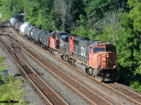 During a summer morning, CN 5669 and 8811 are pictured leading an eastbound off the Dundas Subdivision at Bayview Junction in Burlington, Ontario. 