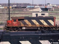 CN GP38-2 7501 is viewed from Toronto’s (Vaughan) MacMillan Yard diesel shop tower awaiting its next call to the hump as another 7500-series set can be seen in the background working the actual hump. To the left is newly built Orinoco Mining SD38-2TC 1048, which was on route from the GMDD plant in London to the AMF facility in Montreal, Quebec for contract painting. This was a mining railroad in Venezuela, that had eight units manufactured and painted in Canada, which were loaded on a ship in Halifax during June of that year to reach their destination. 
<br>
So the story goes, checking my notes, this photo was taken during a MacMillan Yard visit thirty years ago on Mother’s Day 1994. With that in mind, I wish a Happy Mother’s Day to every mom out there both here and now gone. 
