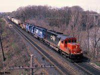 CN "Laser Train" 238 is viewed rolling through Bayview Junction in Burlington, Ontario on the Oakville Subdivision with CN SD40u 6004, Conrail SD40 6261, EMD Leasing GP38-2 790 and a CN GP40-2L(W).