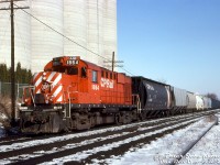 CP RS18u 1864 handles the "Stone Train" local, seen here posing by the Christie Brown mill at Mississauga Road in Streetsville during the late afternoon (possibly doing some switching work).

The Christie Brown (Nabisco) mill here was originally opened under Reid Milling in the 1830's, and is presently operated by Ardent Mills. Off the service track on the right, a switch can be seen for the spur to another mill in Streetsville, the ADM mill (originally Barber Brothers, later McCarthy Milling).
<br><br>
<i>Peter Jobe photo, Dan Dell'Unto collection slide.</i>