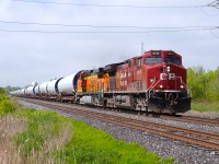 After coming into Agincourt Yard off the Mactier Sub earlier this morning, loaded windmill parts train DIM-08 from Colorado continues through Cherrywood on its way Eastwards to Maine with CP 8113 leading and a repainted Dash-9 BNSF 5228 trailing.