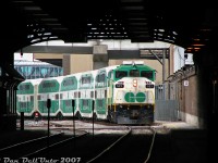 If ever there was a photo summing up commuting on the GO from Union Station in the 2000's, this would be a good contender:<br><br>GO Transit F59PH 521, steel bell clanging away, pulls into the dark train shed of Toronto Union Station on Track 1 (Platform 3B in GO parlance) with the afternoon "Bramalea Flip" from Brampton (Bramalea GO to Union). The consist is coming off eastbound #260, arriving just a bit late (pulling in 16 minutes behind its scheduled arrival time of 12:48pm, probably due to grade separation work at the West Toronto diamond). We'd board it, and the train would depart as westbound #263 (the 1 o'clocker flip run to Bramalea) running a bit late, with unrebuilt "ogre eye" cab car 225 on point for the trip west.<br><br>Afternoon ridership was still pretty light on the Bramalea Flip at the time (to the point where you could enjoy an entire car to yourself for the whole trip, depending on which and where you boarded), but in a year or two things would pick up. And since it ran outside of rush hours, running the Bramalea Marathon to be first to your car to burn rubber out of the parking lot was not necessary until after 4pm.