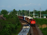 CN 327 and VIA 64 meet at speed in Beaconsfield.
